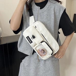 Minimalist white nylon crossbody bag with multi-pocket design and adjustable strap