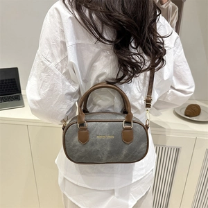 Retro grey bowling bag with brown straps, large capacity shoulder bag shown on model