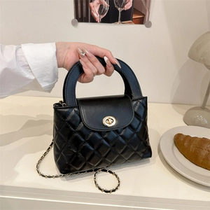 Elegant black quilted crossbody bag with gold chain strap and top handle for women