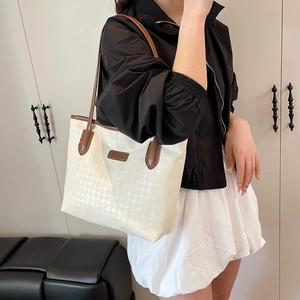 Chic houndstooth tote bag in cream and brown with long shoulder straps for daily commute