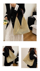 Detail of woven straw shoulder bag with brown leather handle in a cozy home setting
