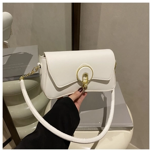 Detail of white leather shoulder bag with a gold circular buckle and chain strap