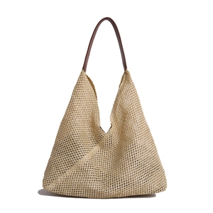 French woven straw hollow tote bag with brown leather strap for summer beach vacation