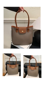 Détail du sac cabas bicolore gris et marron avec texture litchi et logo doré en métal