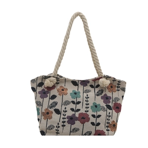 Retro floral canvas tote bag with colorful flower patterns and thick rope handles
