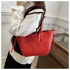 Red lychee grain PU leather tote bag with white contrast stitching and side knot detail