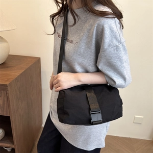 Minimalist black oxford cloth crossbody bag with large buckle for fitness and travel
