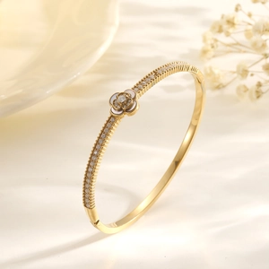 Elegant gold flower bracelet with white camellia petals and sparkling micro zircons