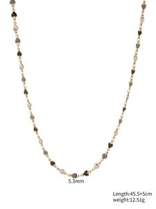 Detailed view of 45.5cm gold necklace with multi-colored enamel heart beads