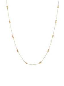 Detail einer minimalistischen goldenen Perlenkette mit Hochglanz-Finish