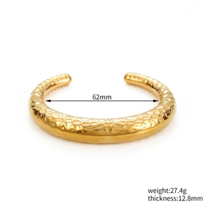 Detail of gold-plated hammered cuff bracelet showing 12.8mm thickness and 62mm diameter