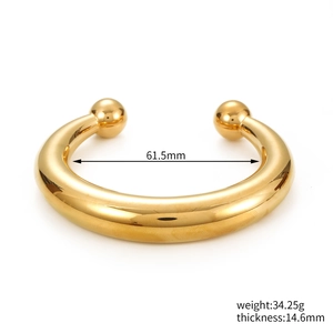 Detailed view of gold plated C-shape bangle with 61.5mm inner diameter and 34.25g weight