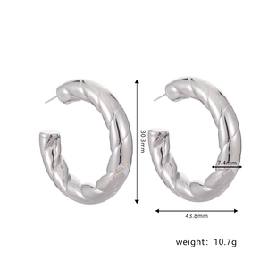 Detailed view of silver spiral hoop earrings with dimensions and weight measurements