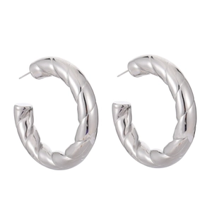 Exaggerated spiral hollow hoop earrings with classic twisted rope texture in silver finish