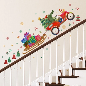 Detail of Christmas wall sticker featuring a crocodile driving a gift truck on stairs