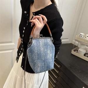 Vintage denim doctor bag with brown leather handle and silver chain strap for women