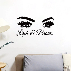Detailed view of Lash & Brows black wall sticker on a minimalist white living room wall