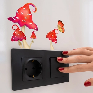 Luminous mushroom wall stickers applied above a light switch with colorful butterfly detail