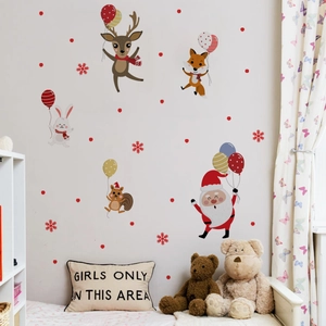 Detail of Christmas wall stickers featuring cartoon Santa, elk, and animals with balloons