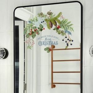 Christmas wreath static window sticker with red berries and pine cones on a mirror