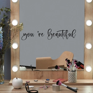 Macro shot of You Are Beautiful vinyl mirror decal with elegant black cursive handwriting