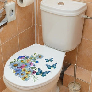 Detail of floral and butterfly PVC stickers applied on a white toilet lid cover