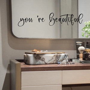Detail of you're Beautiful vinyl wall sticker on a vanity mirror with elegant decor