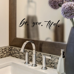 Detail of Be.you.tiful. mirror wall sticker applied to a wooden bathroom mirror frame