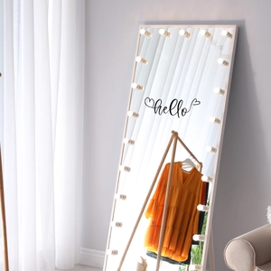 Detail of hello artistic wall sticker on a Hollywood style illuminated vanity mirror