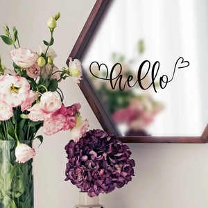 Detail of hello vinyl decal sticker with heart on a hexagonal mirror frame