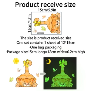 Glow-in-the-dark cat wall sticker showing daytime orange color and nighttime green fluorescence