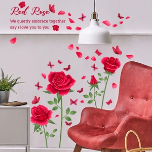Detail of red rose wall decals with butterflies and romantic quote in living room decor