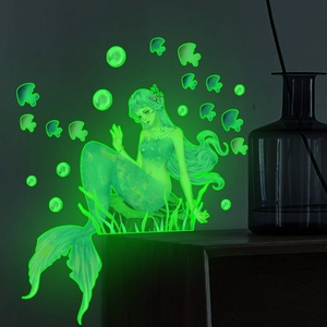 Luminous mermaid wall sticker with fish and bubbles glowing in dark bedroom setting