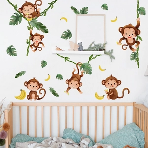 Nursery room wall stickers featuring watercolor monkeys and green palm leaves
