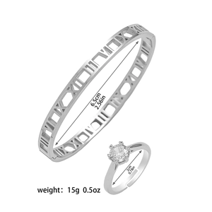 Macro detail of Roman numeral bangle and solitaire ring set with size specifications