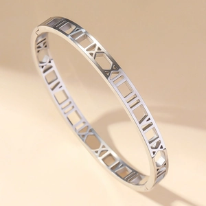 Silver stainless steel bangle featuring an elegant hollow roman numeral pattern design