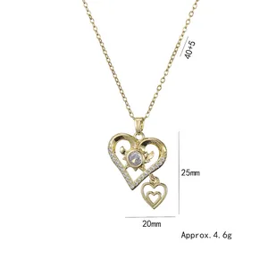 Élégant collier double cœur doré avec cristaux de zircon et chaîne fine pour femmes