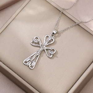 Silver cross pendant necklace with heart cutouts and rectangular cubic zirconia on satin box