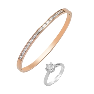 Rose gold zircon studded bangle and silver solitaire ring set on white background
