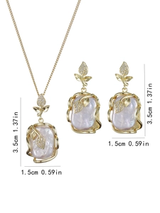 Detailed size view of baroque pearl necklace and earrings with 3.5cm gold leaf pendant