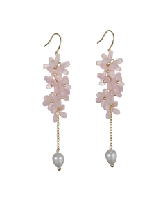 Detailed close-up of pink flower cluster earrings with long gold chains and pearl drops