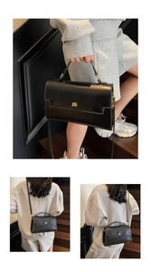 Detail shots of black PU leather crossbody bag with gold hardware and logo on stairs