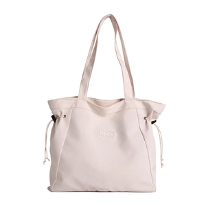 Minimalist beige canvas tote bag with FASHION label and adjustable drawstring sides