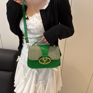 Green and monochrome zigzag patterned saddle bag with a metallic V logo buckle for women