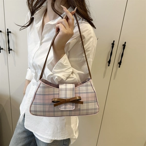 Pink and white checkered baguette shoulder bag with brown leather bow and strap