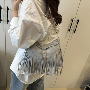 Vintage grey bohemian suede shoulder bag with long fringes and metal buckle detail