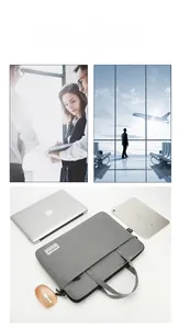 Detailed view of minimalist gray laptop sleeve showing zipper pocket and fabric texture