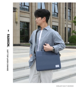 Detailed view of a navy blue business laptop bag with premium top grain leather texture