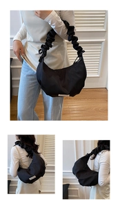 Détail du sac à bandoulière noir plissé avec étiquette mode et texture croissant
