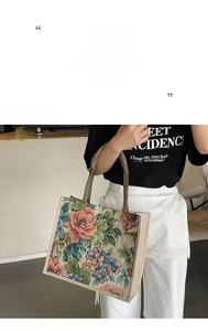 Detailed close-up of large floral print on a linen tote bag with braided handles